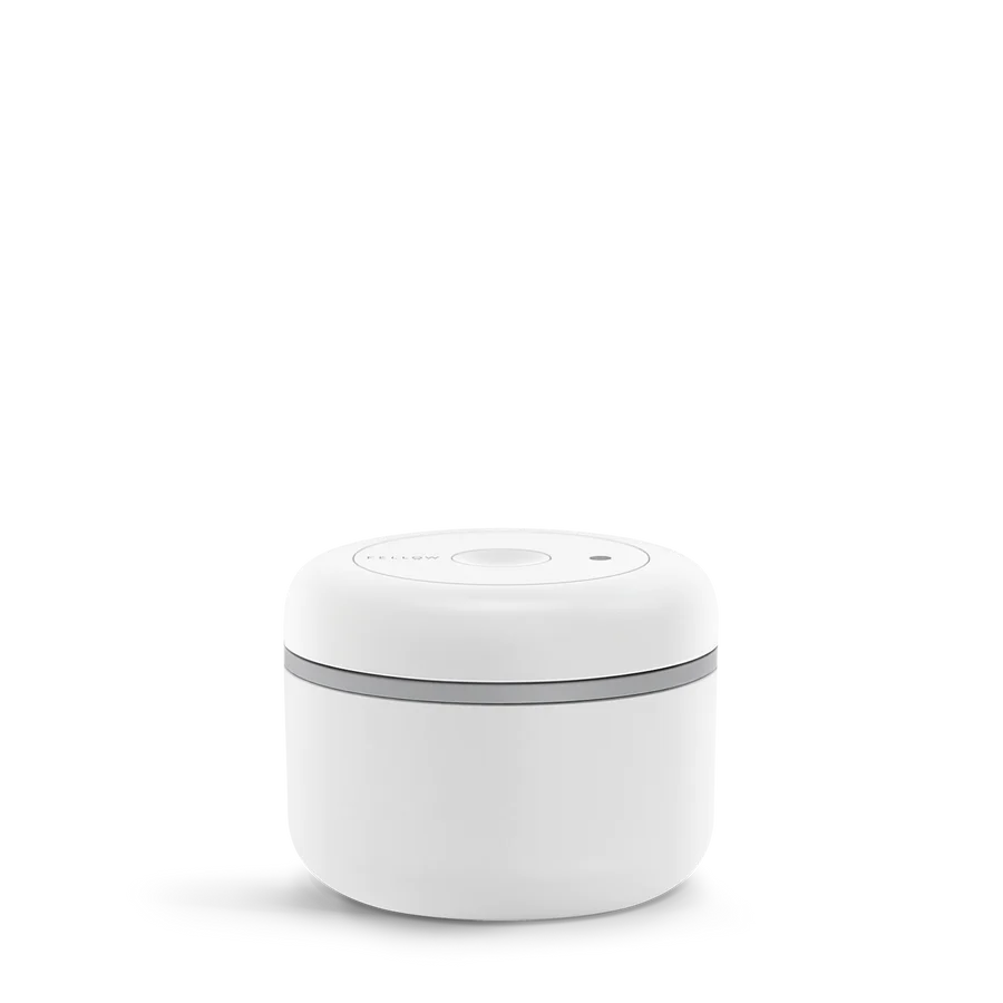 Fellow White Atmos Coffee Vacuum Canister featuring an advanced twist mechanism that keeps coffee fresh. 